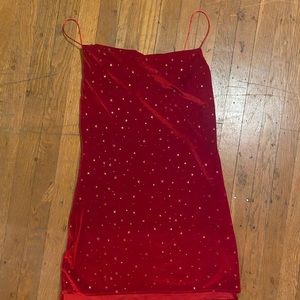Red velvet dress with stars. Short slit on both sides.